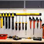 A well-organized workshop featuring various pneumatic tools hanging neatly on a wall, with a focus on the different types like impact wrenches, sanders, and drills. The scene is brightly lit, showcasing the tools' details and functionality, and perhaps with a Swedish "verktygslåda" (toolbox) visible.